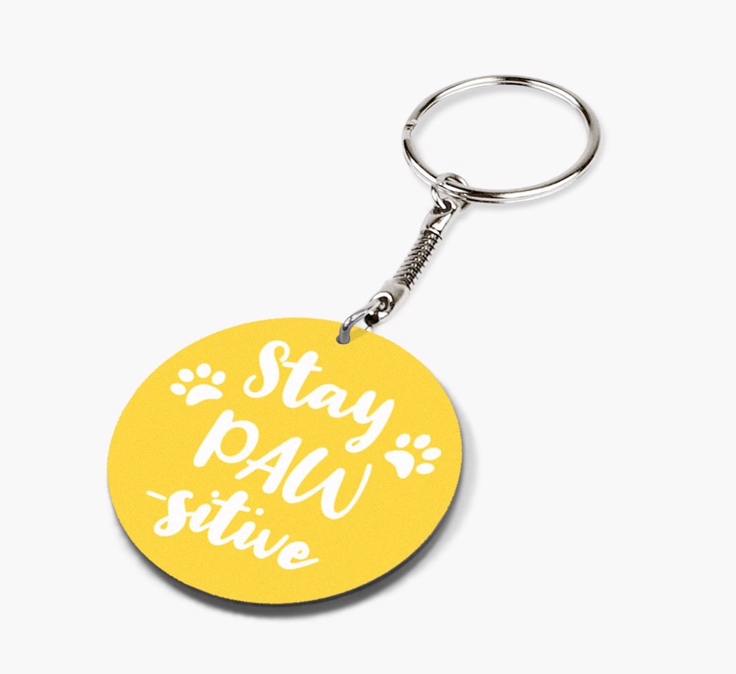 Double-sided 'Stay Paw-sitive' keychain